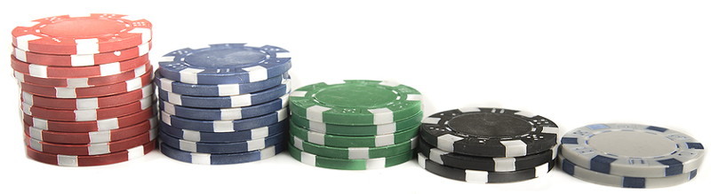 casino chips different colours and different sized piles